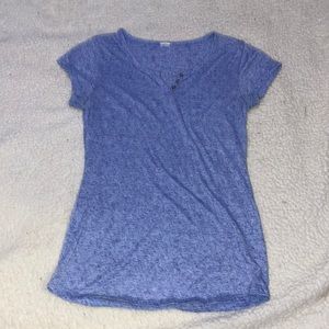 A blue short sleeve shirt with 3 button up